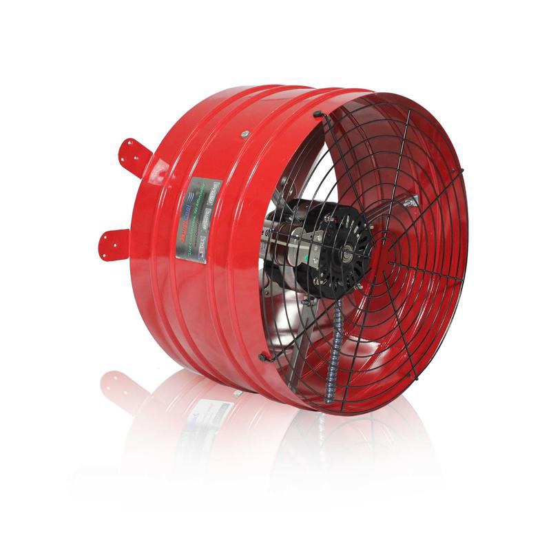 A bright red barrel-shaped industrial fan with a visible black motor and protective metal grate on a white background.